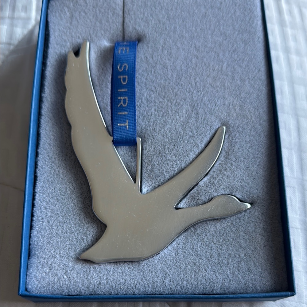 Grey goose ornament with blue ribbon “Share the spirit” in original box